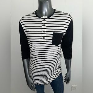 Black and white striped top. Size medium. Quarter length black sleeves.